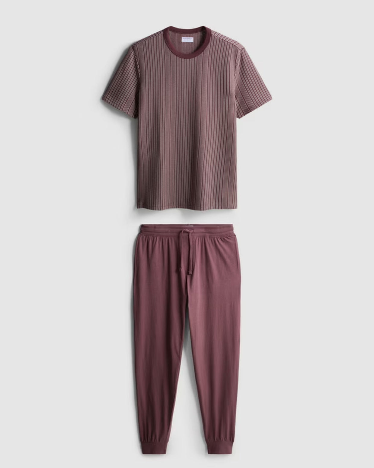 A pair of textured long pyjamas with a shortsleeved top and drawstring bottoms
