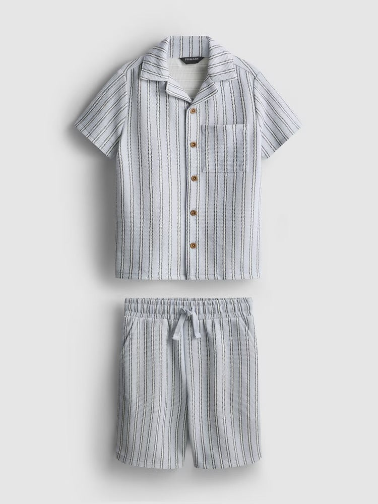 A knitted shirt and shorts co-ord in a stripe pattern