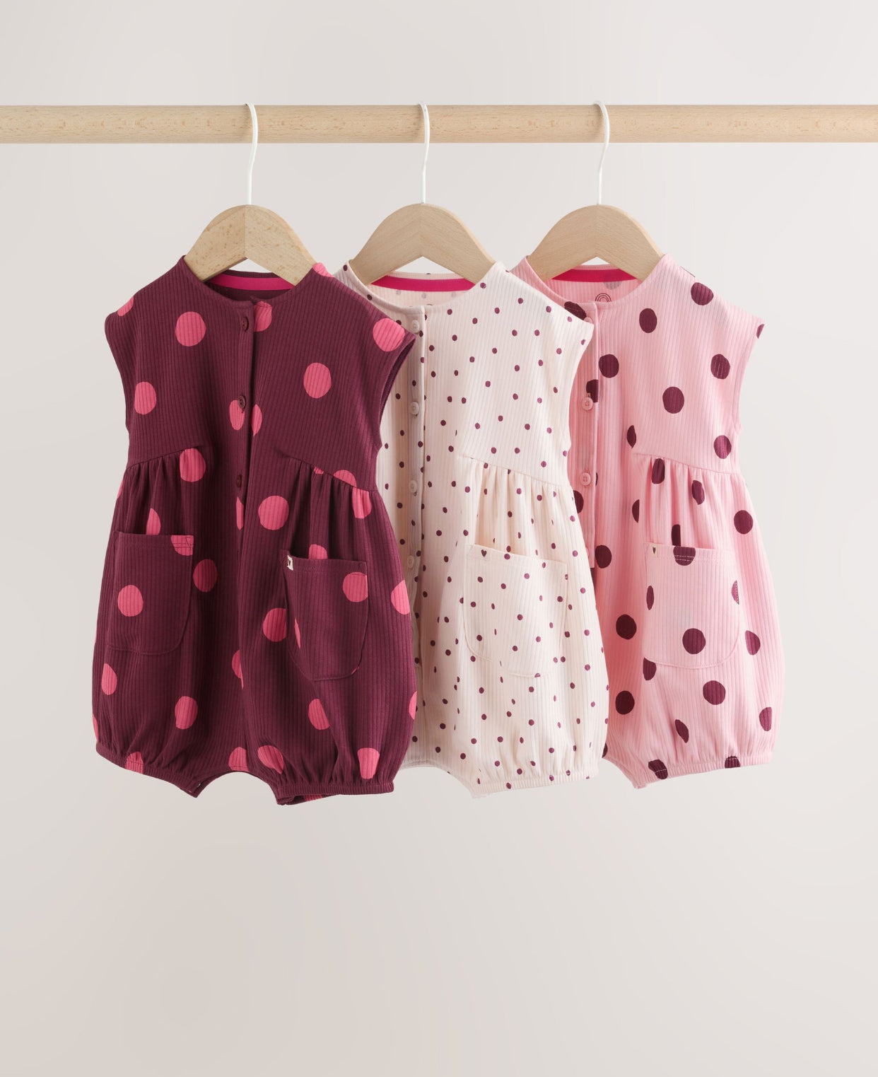 Pink Polka Dot Button Through Baby
Rompers 3 Pack
