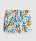 A pair of textured swimming shorts with orange and ocean design with a drawstring waistline