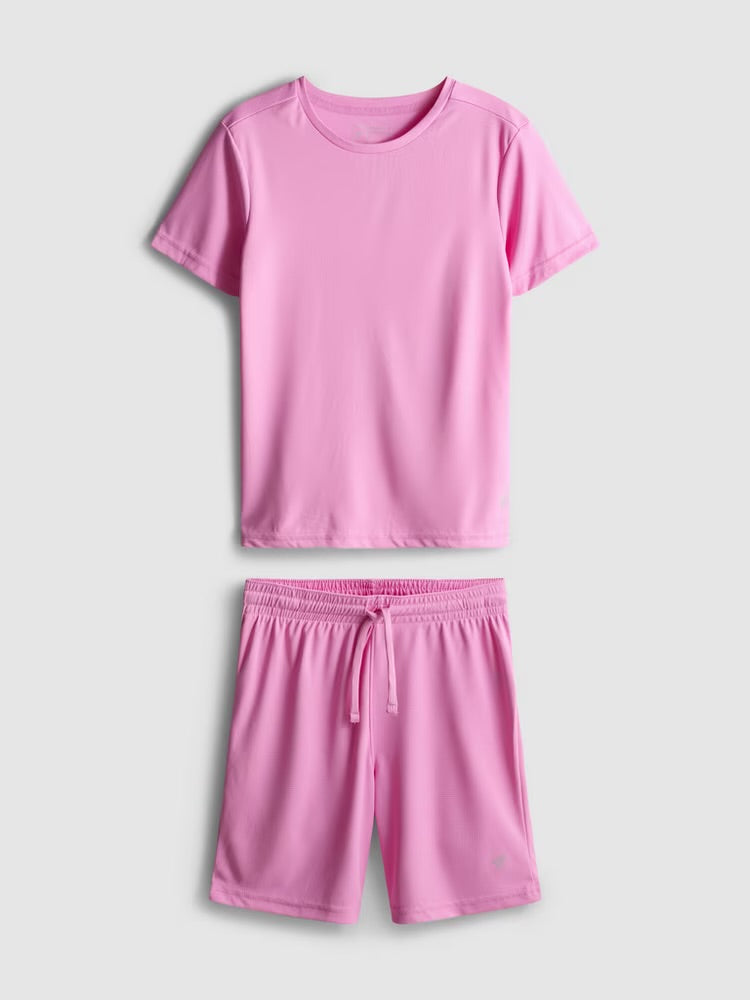 This sporty clothing set includes a short sleeve top and drawstring-detail shorts