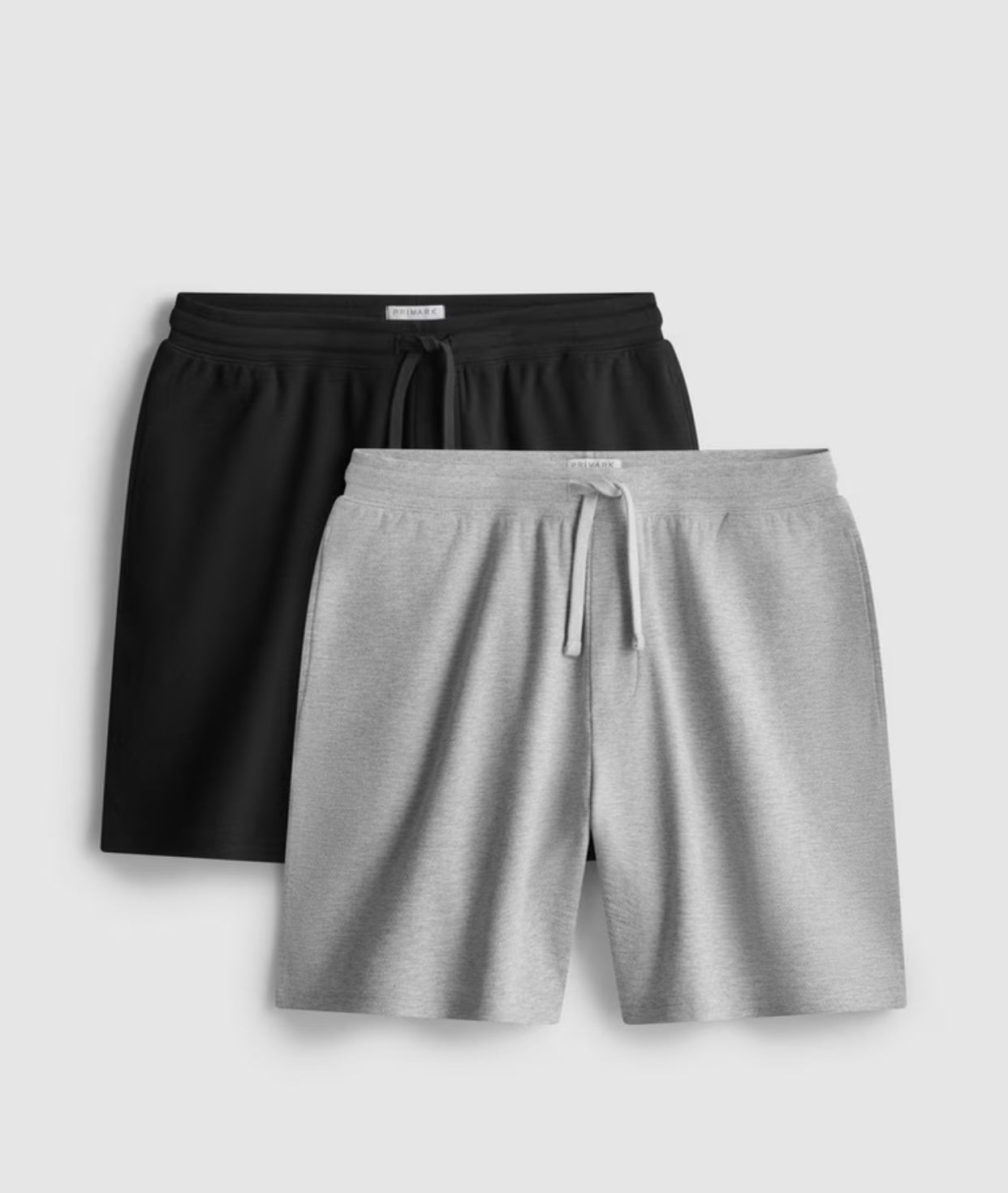 A pack of two textured pyjama shorts with a drawstring waistline