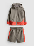 An activewear track jacket and shorts clothing co-ord