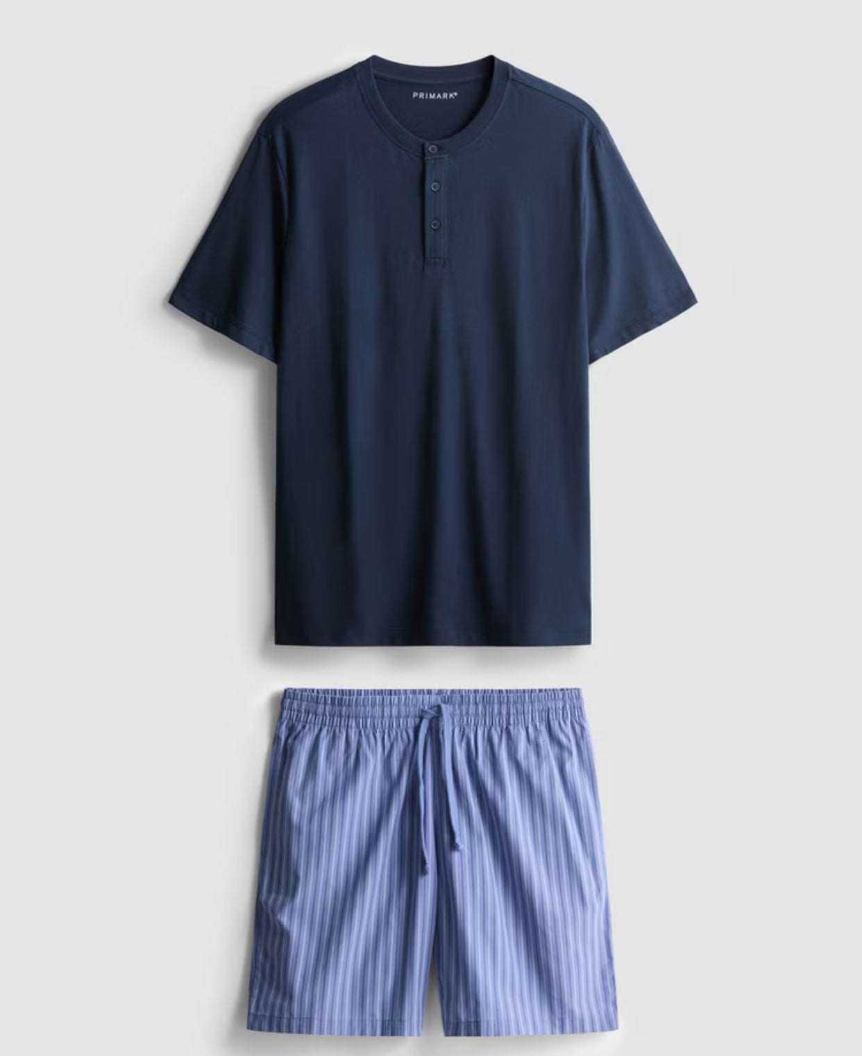 A pair of short pyjamas with short sleeve top and shorts