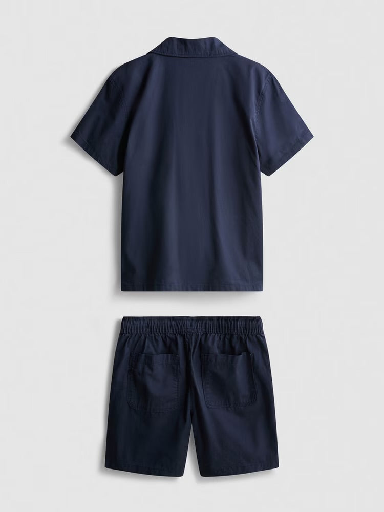 A poplin button-up shirt and drawstring-detail shorts co-ord