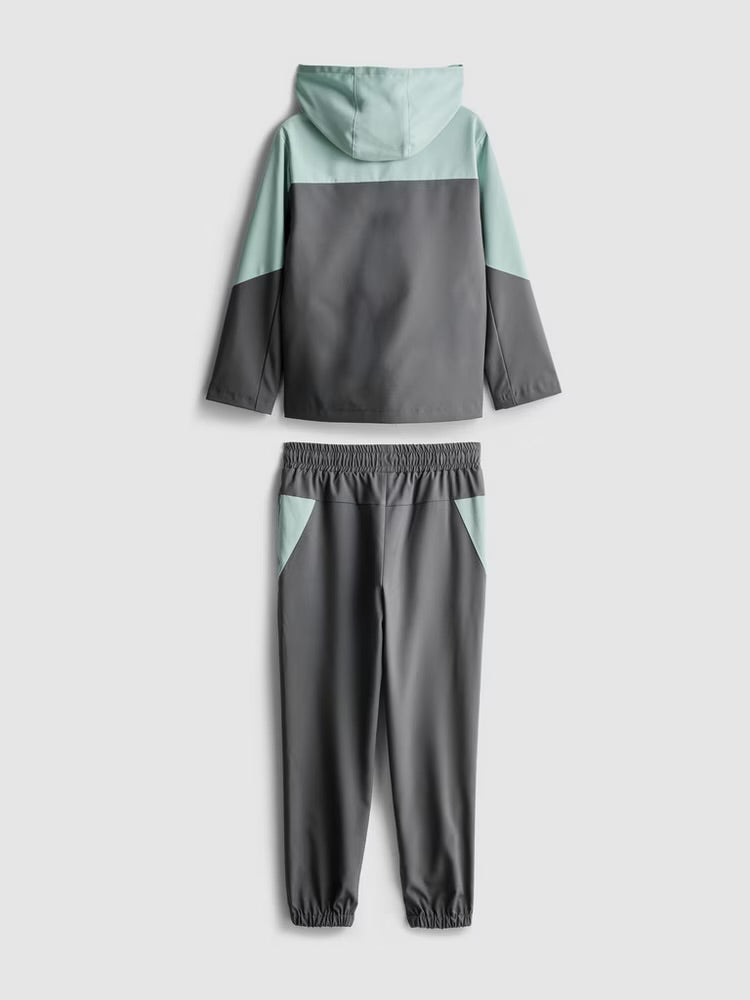 An activewear zip-up jacket and cuffed joggers clothing co-ord