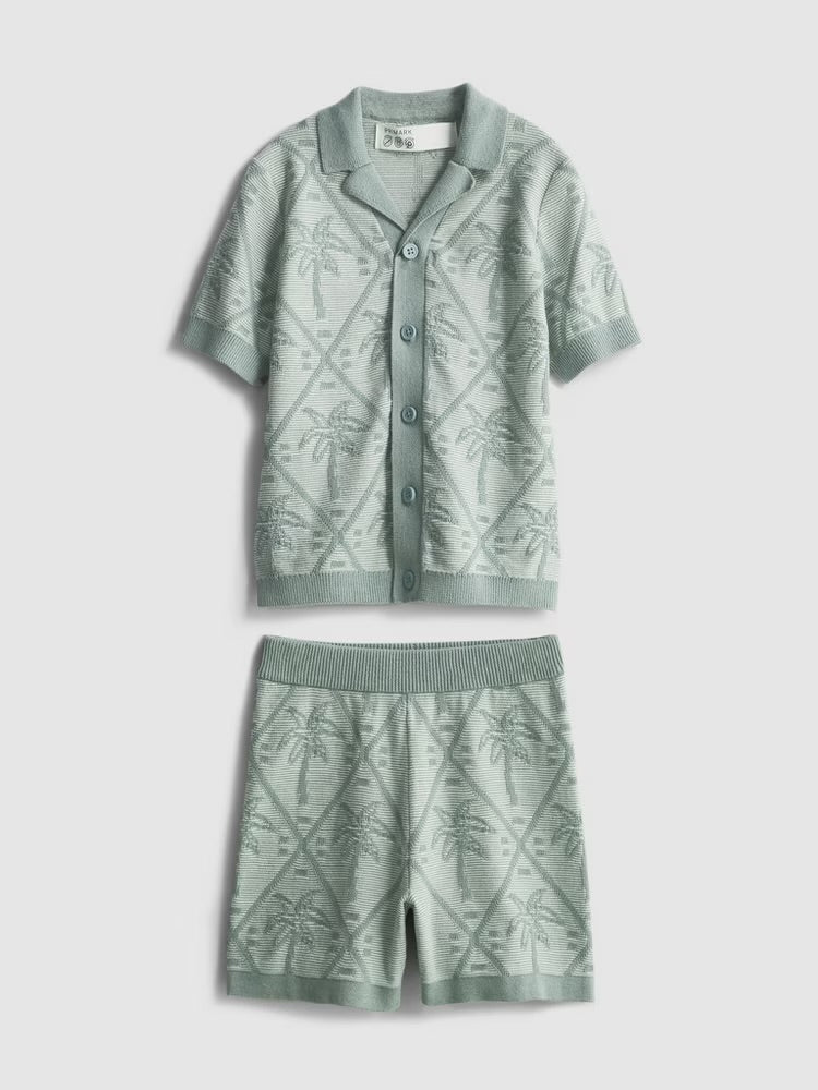 A knitted shirt and shorts clothing co-ord with a palm tree design