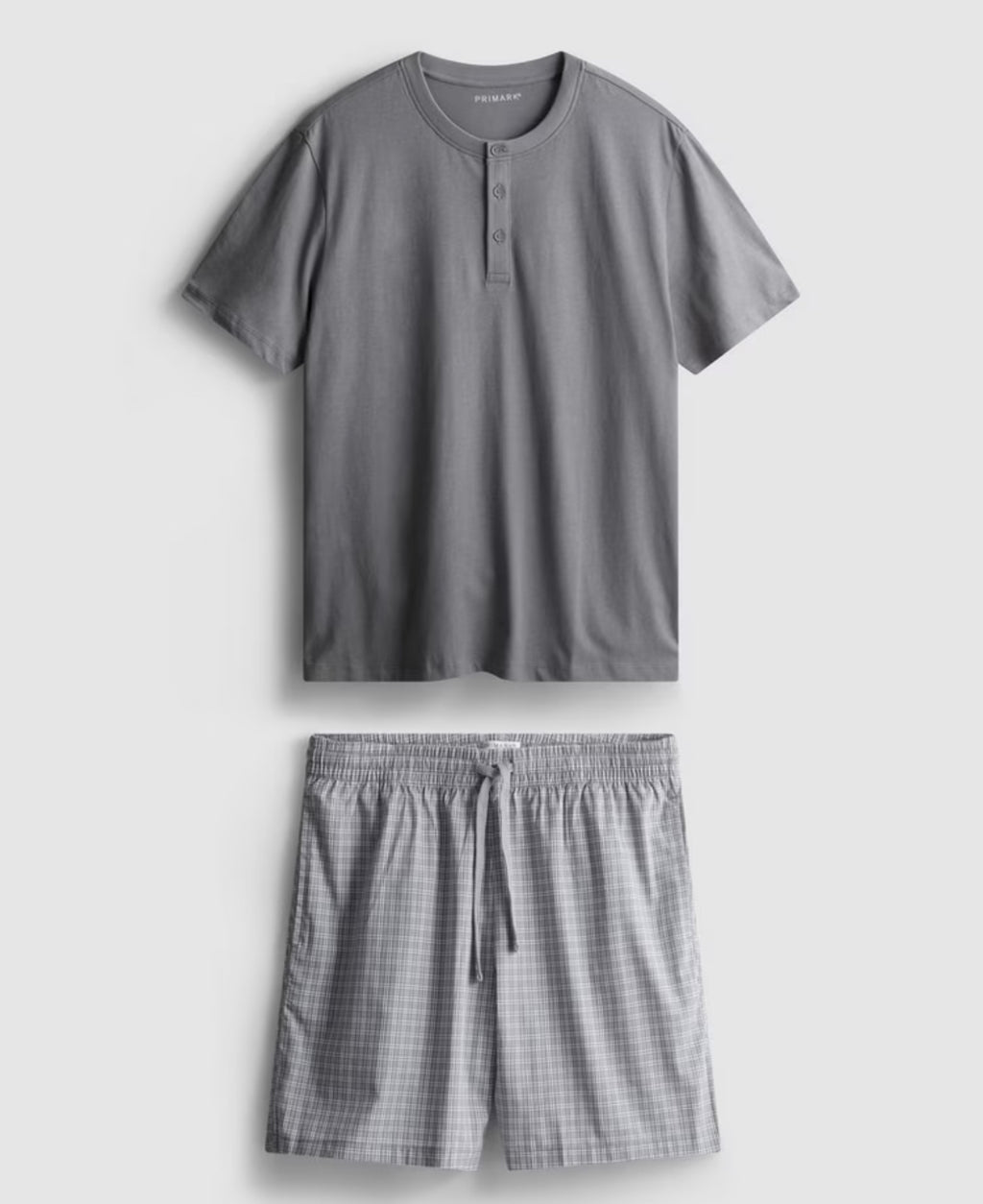 A pyjama set with short sleeves and check shorts