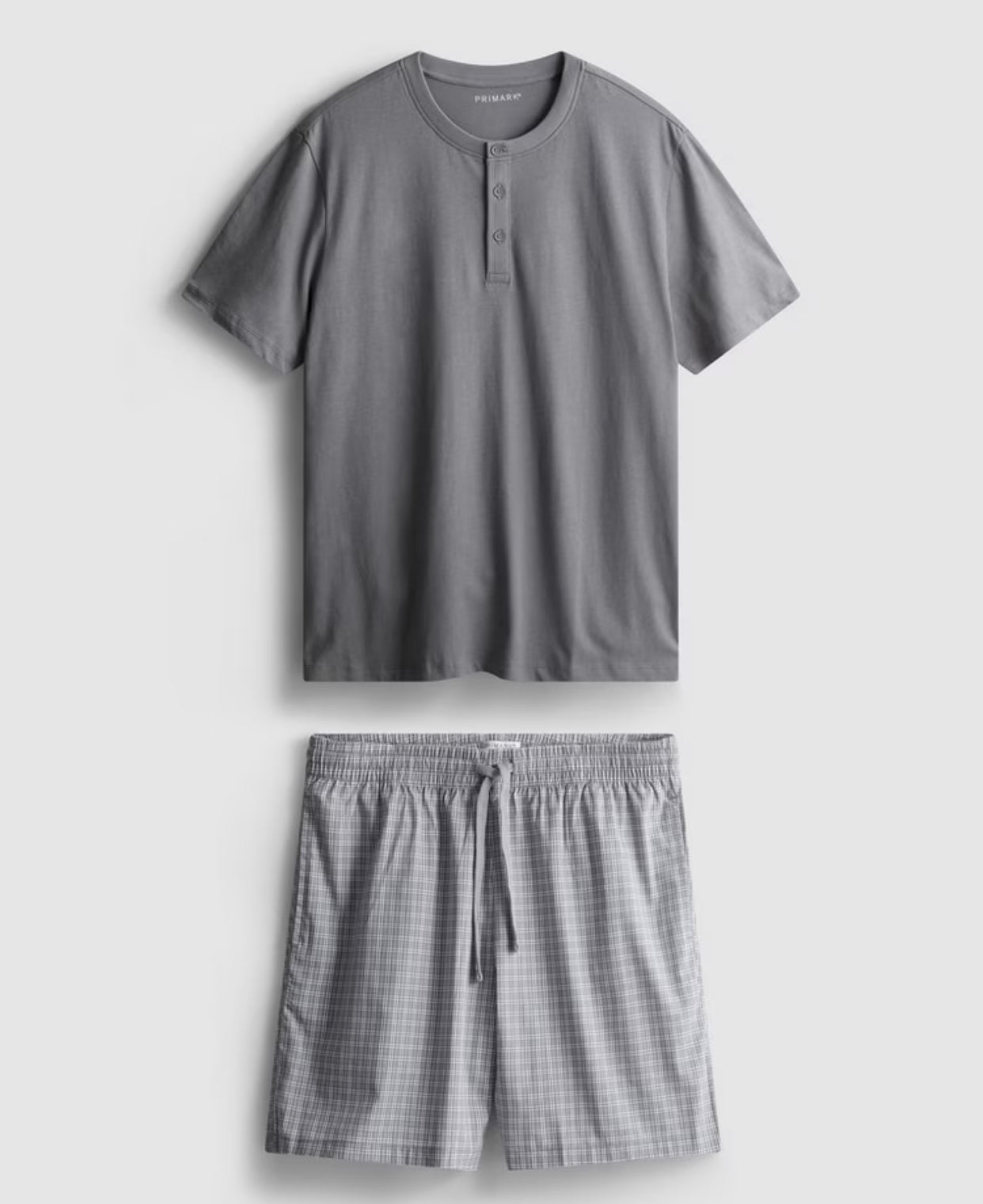 A pyjama set with short sleeves and check shorts