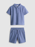 A polo shirt and shorts clothing co-ord