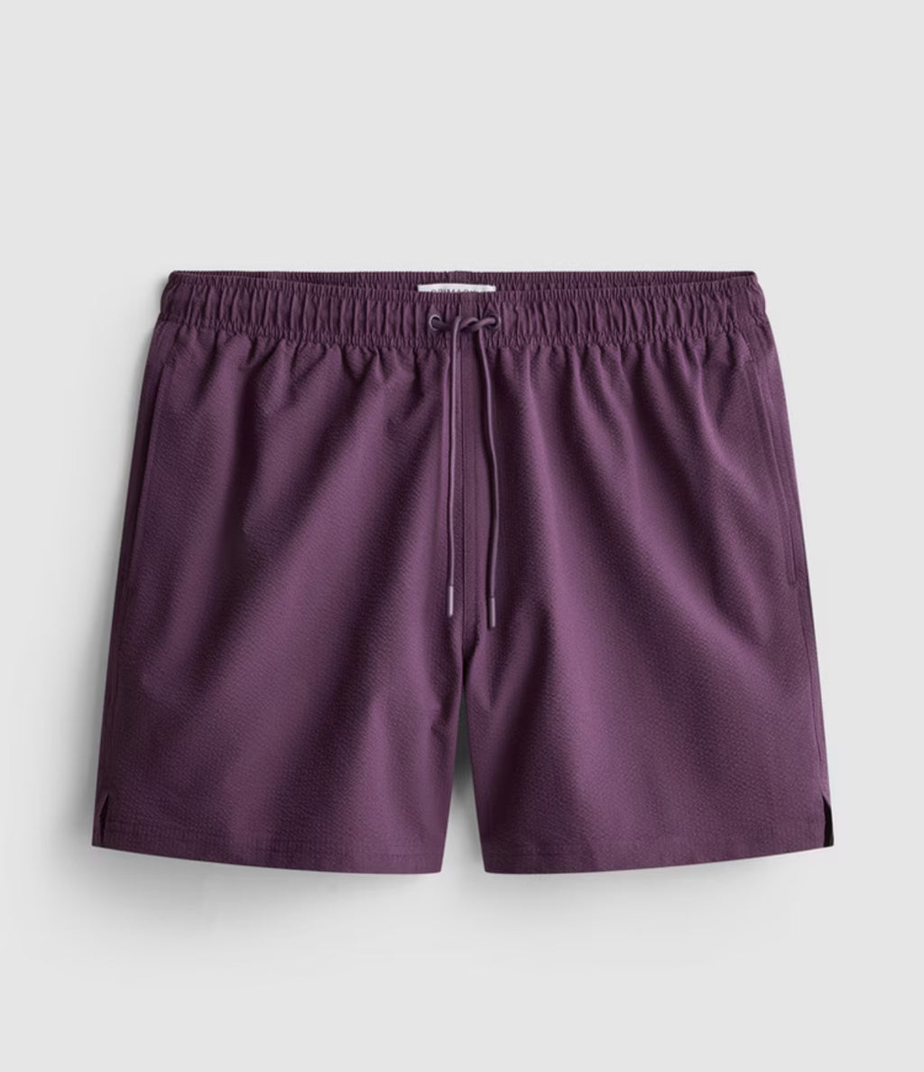 A pair of textured swimming shorts with a drawstring waistline