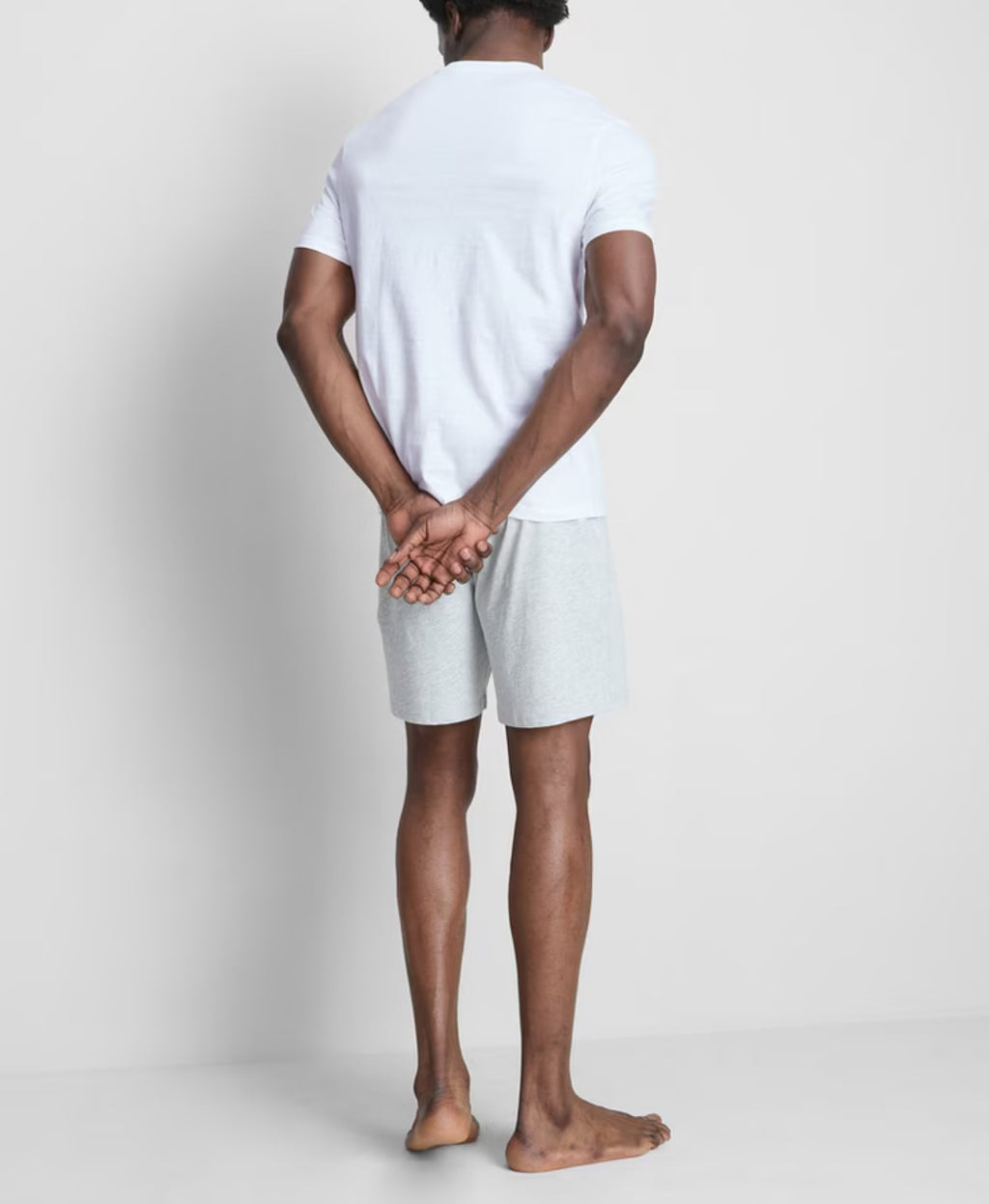 A pair of pyjamas with shorts, top, and graphic design
