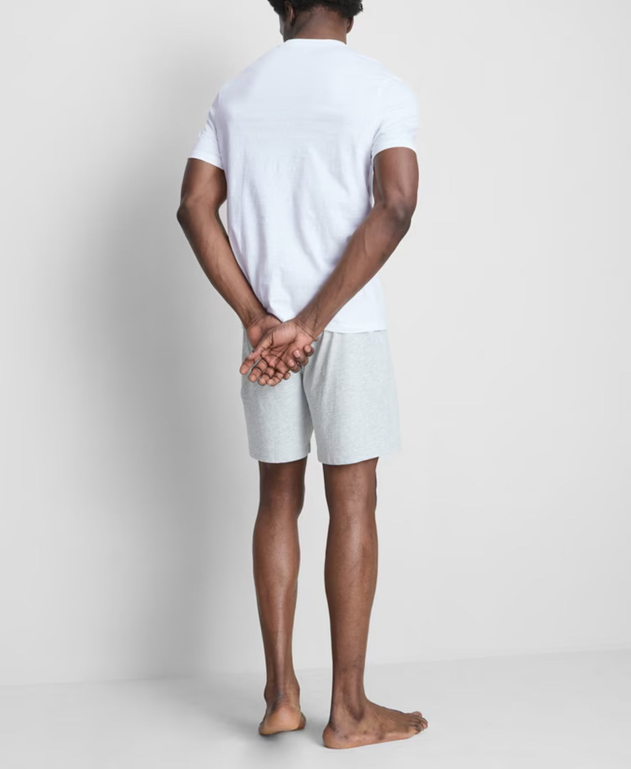 A pair of pyjamas with shorts, top, and graphic design