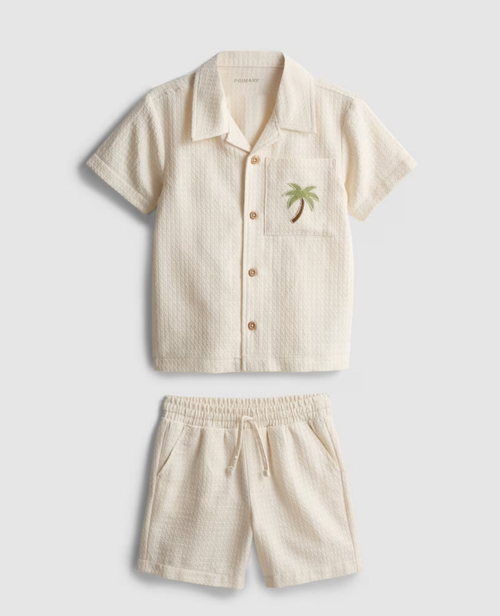 A shirt and shorts co-ord with embroidery detailing
