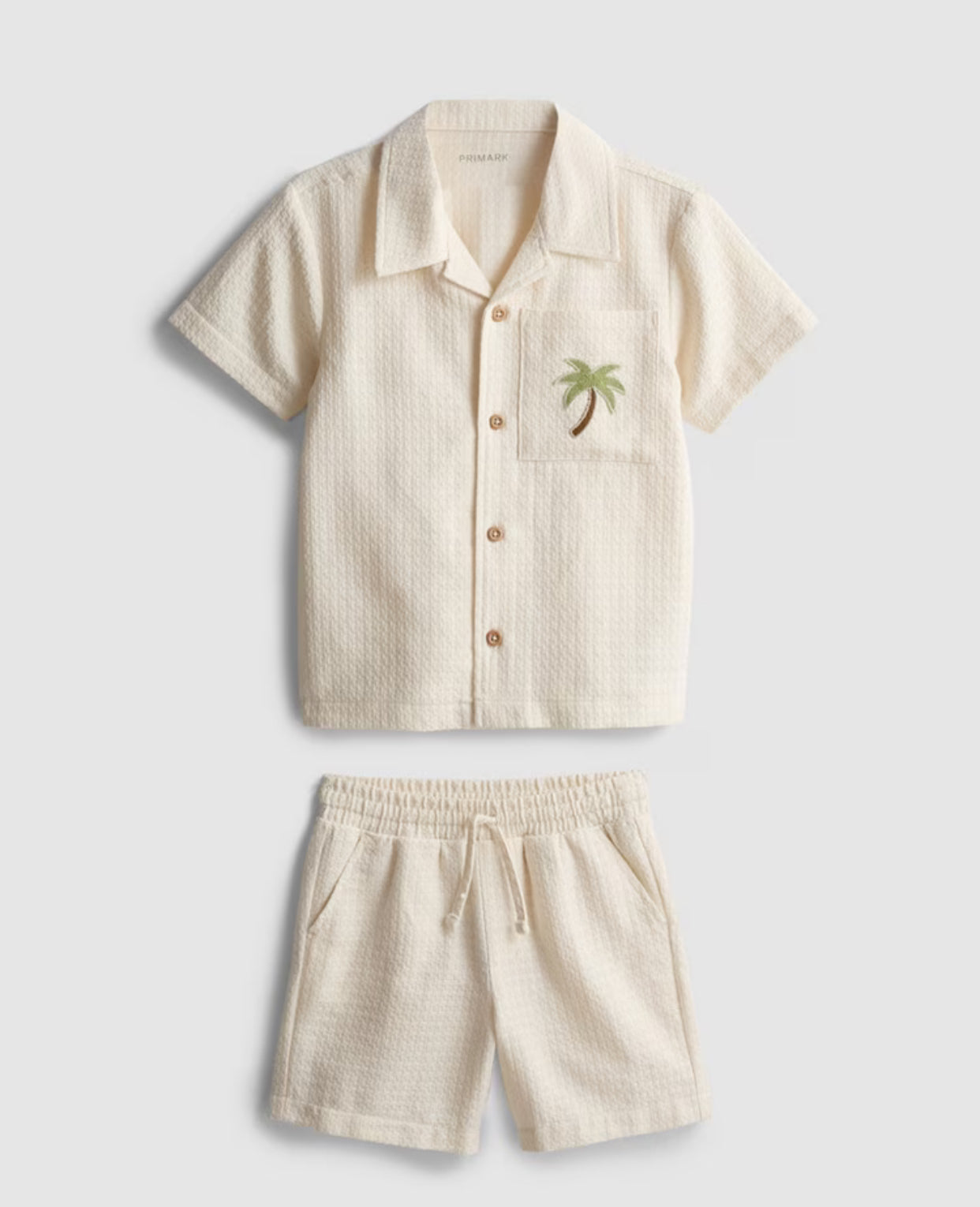 A shirt and shorts co-ord with embroidery detailing