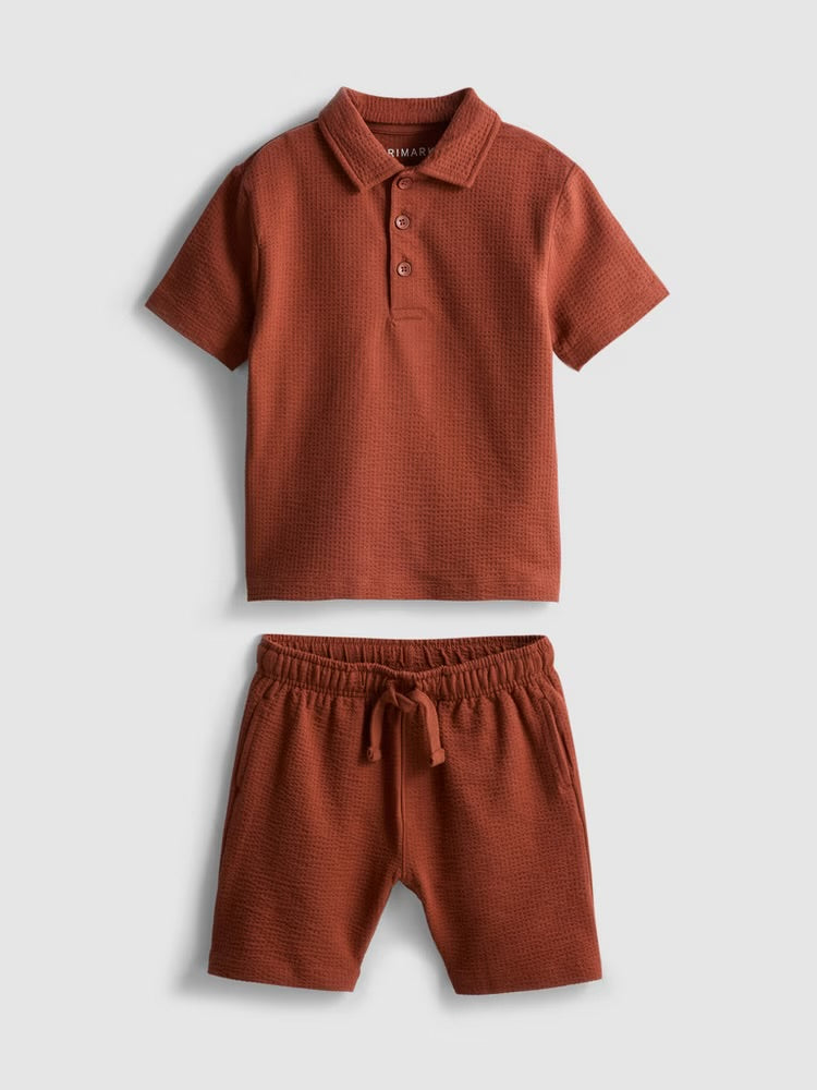A textured polo shirt and shorts clothing co-ord
