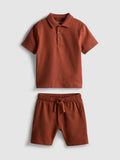 A textured polo shirt and shorts clothing co-ord
