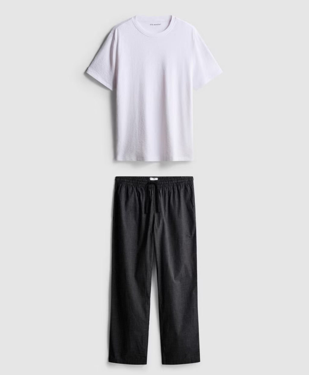 A pair of textured long putjamas wirh short sleeved top and bottoms