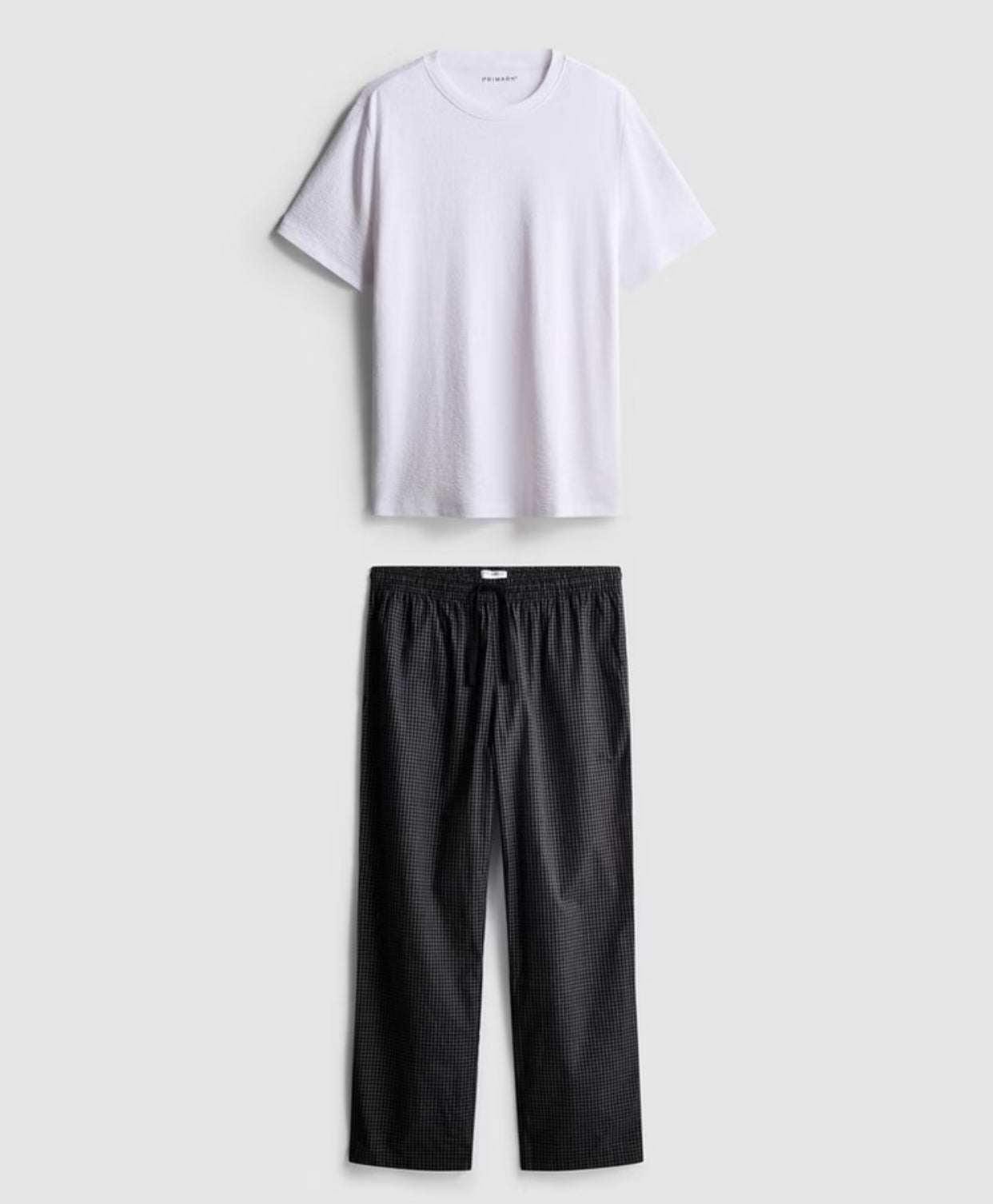 A pair of textured long putjamas wirh short sleeved top and bottoms
