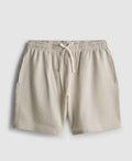 A pair of pyjama shorts with textured stripes, a drawstring waistline, and pockets