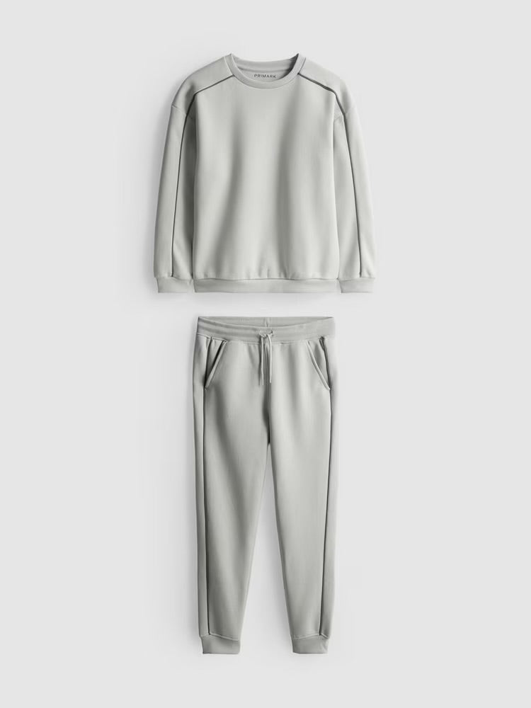 A pullover sweatshirt and cuffed joggers clothing co-ord