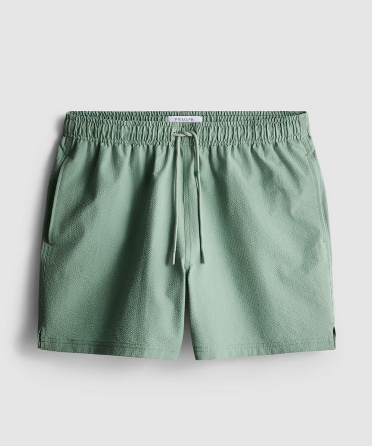A pair of textured swimming shorts with a drawstring waistline