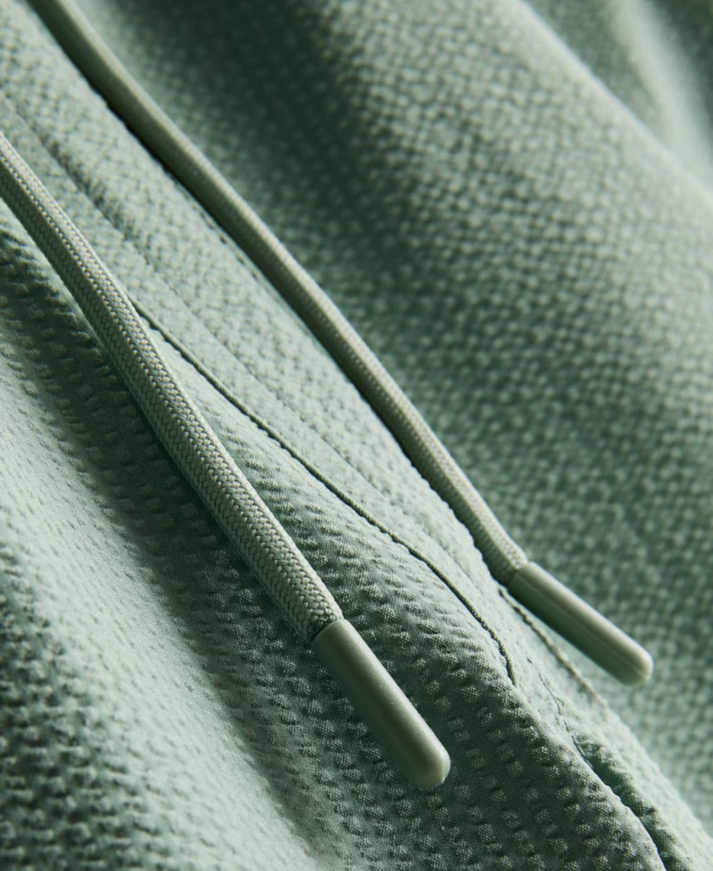 A pair of textured swimming shorts with a drawstring waistline