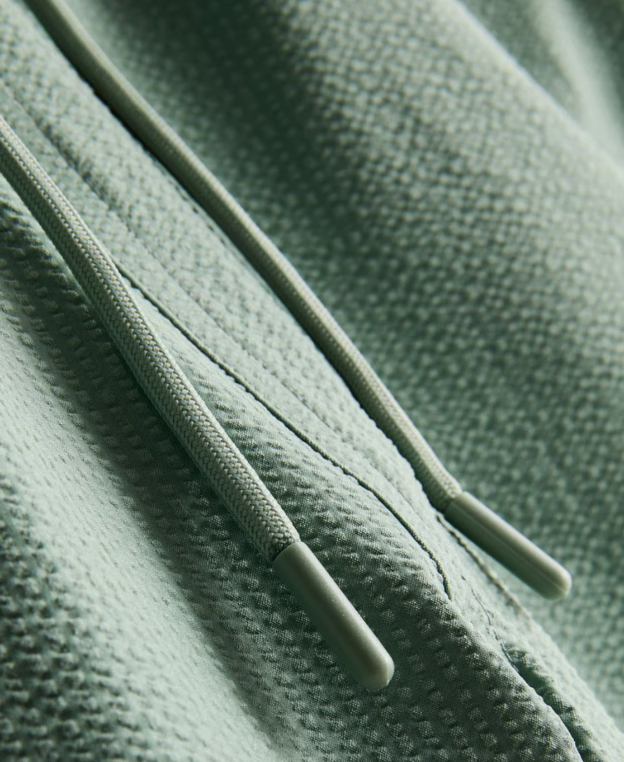 A pair of textured swimming shorts with a drawstring waistline
