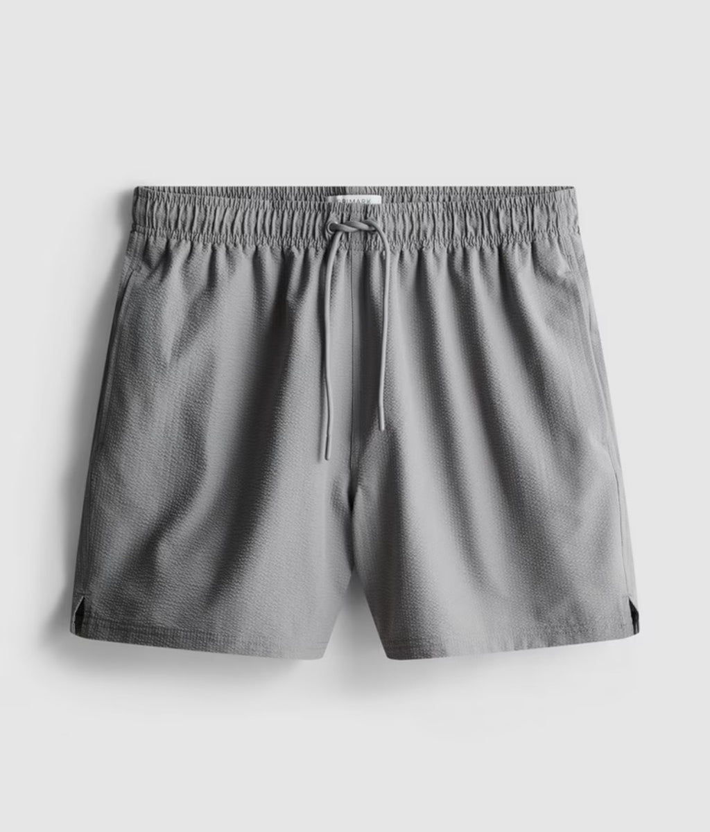 A pair of textured swimming shorts with a drawstring waistline