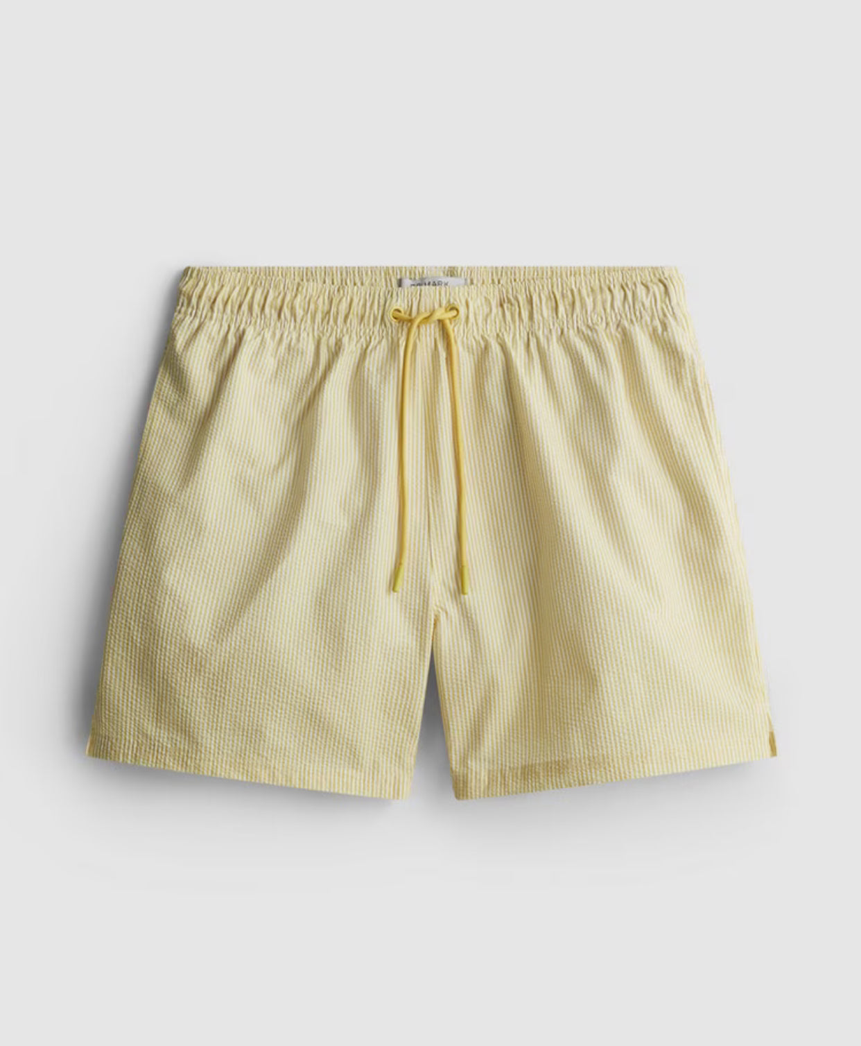 A pair of striped seersucker swimming shorts with a drawstring waistline, pockets, and mesh lining.