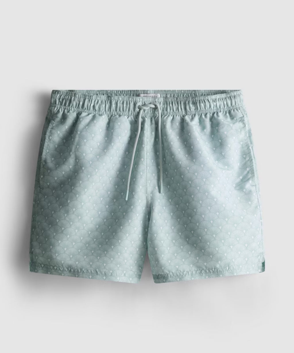 A pair of swimming shorts with mesh inner lining, drawstring waistline, and geometric fan design