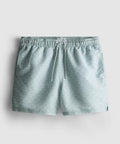 A pair of swimming shorts with mesh inner lining, drawstring waistline, and geometric fan design