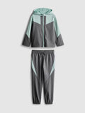 An activewear zip-up jacket and cuffed joggers clothing co-ord