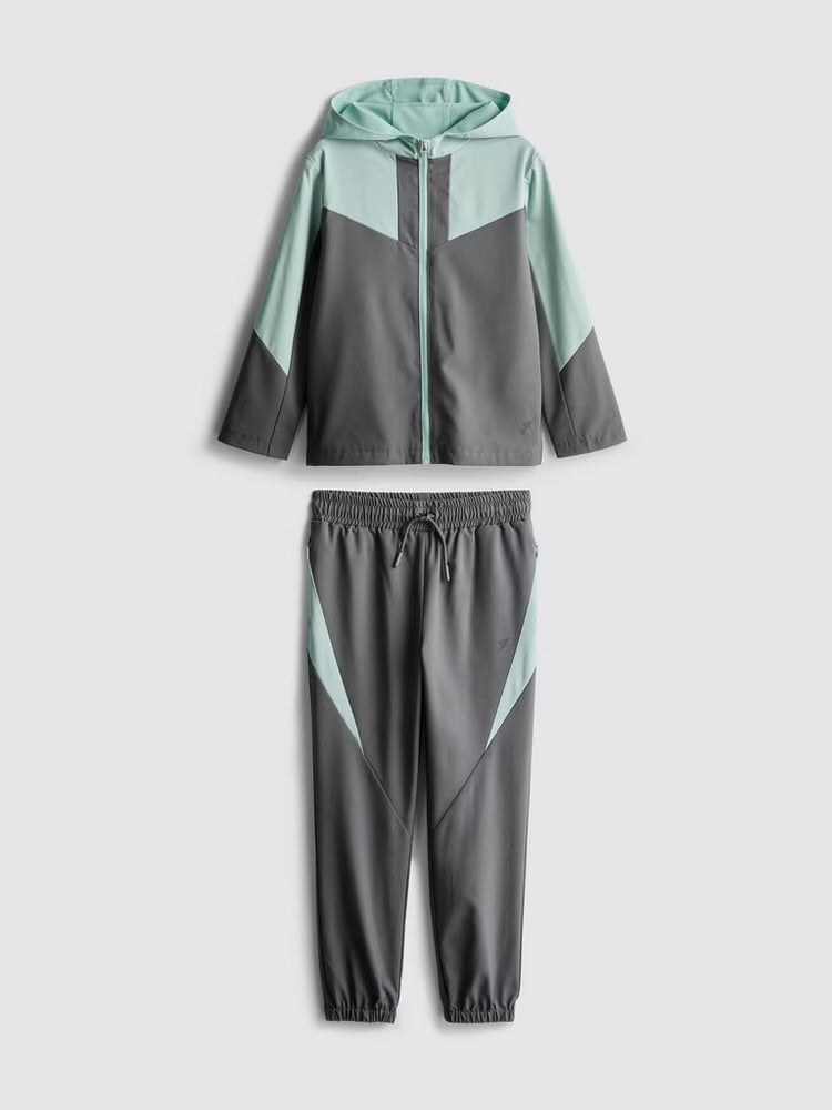 An activewear zip-up jacket and cuffed joggers clothing co-ord