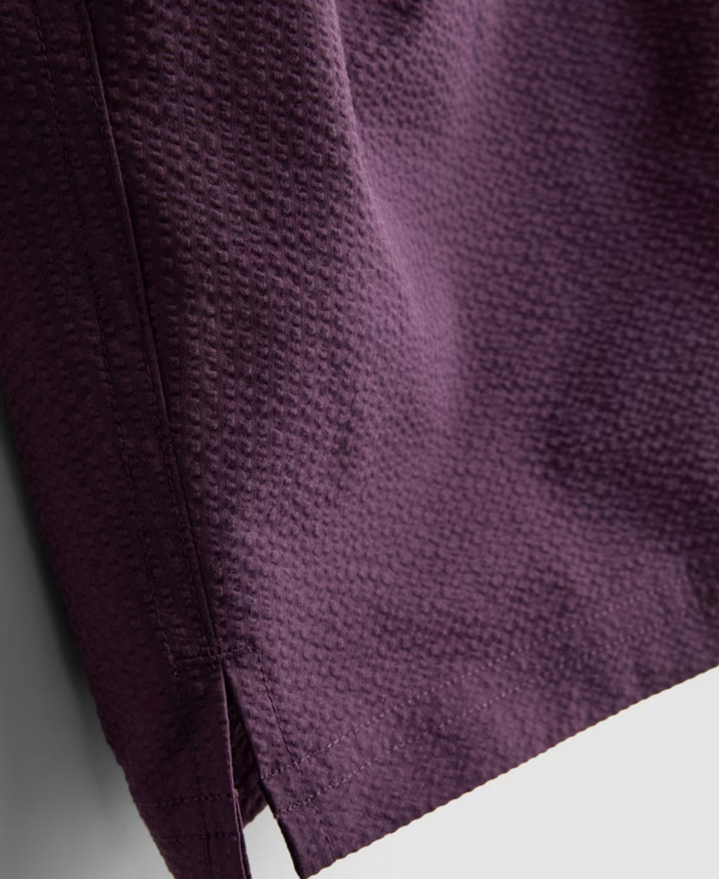 A pair of textured swimming shorts with a drawstring waistline