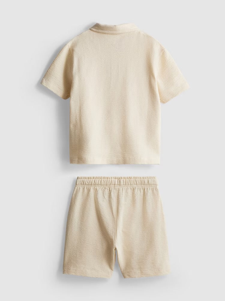 A textured polo shirt and shorts clothing co-ord