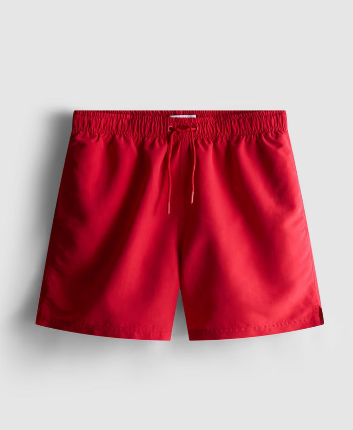A pair of microfibre swimming shorts with drawstring waistline, and inner mesh