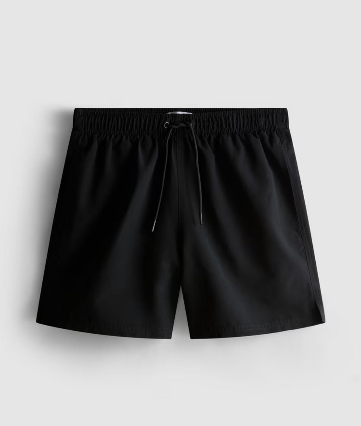 A pair of microfibre swimming shorts with drawstring waistline, and inner mesh