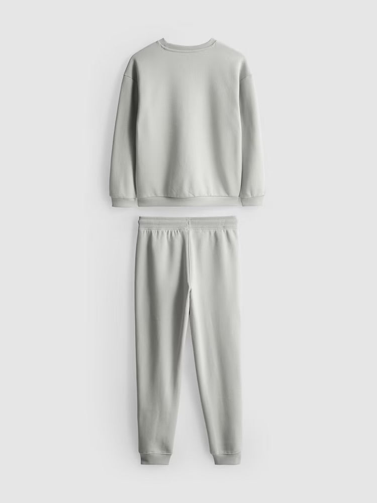A pullover sweatshirt and cuffed joggers clothing co-ord