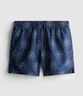 A pair of swimming shorts with embroidered sun design, mesh inner, and drawstring waistline
