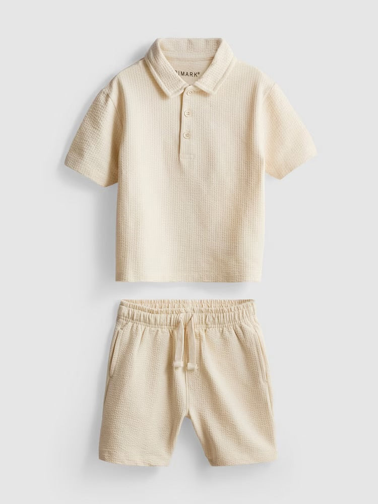 A textured polo shirt and shorts clothing co-ord