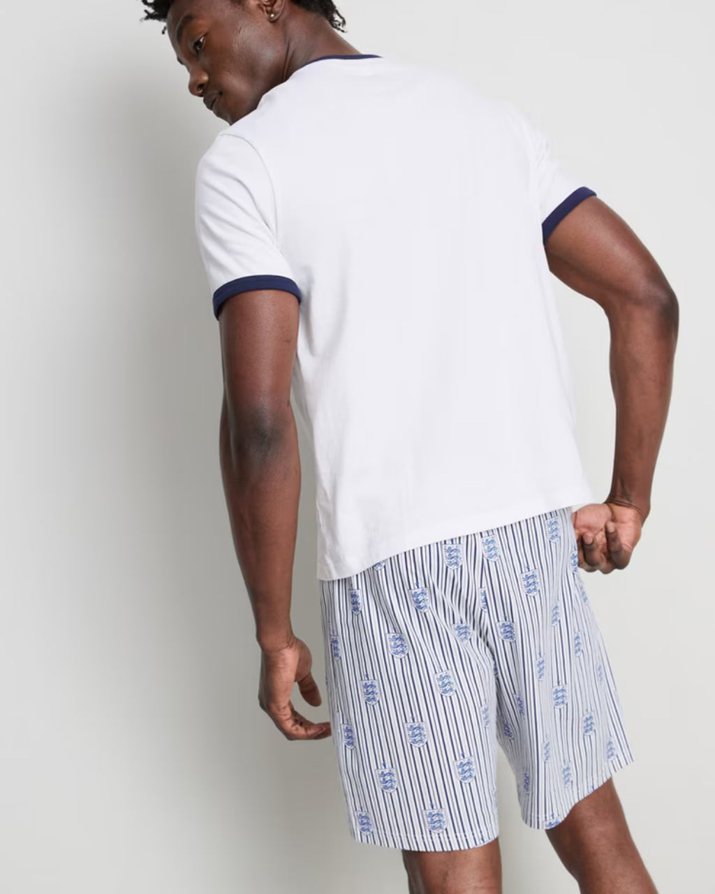 Pyjama set with England T-shirt and printed striped shorts