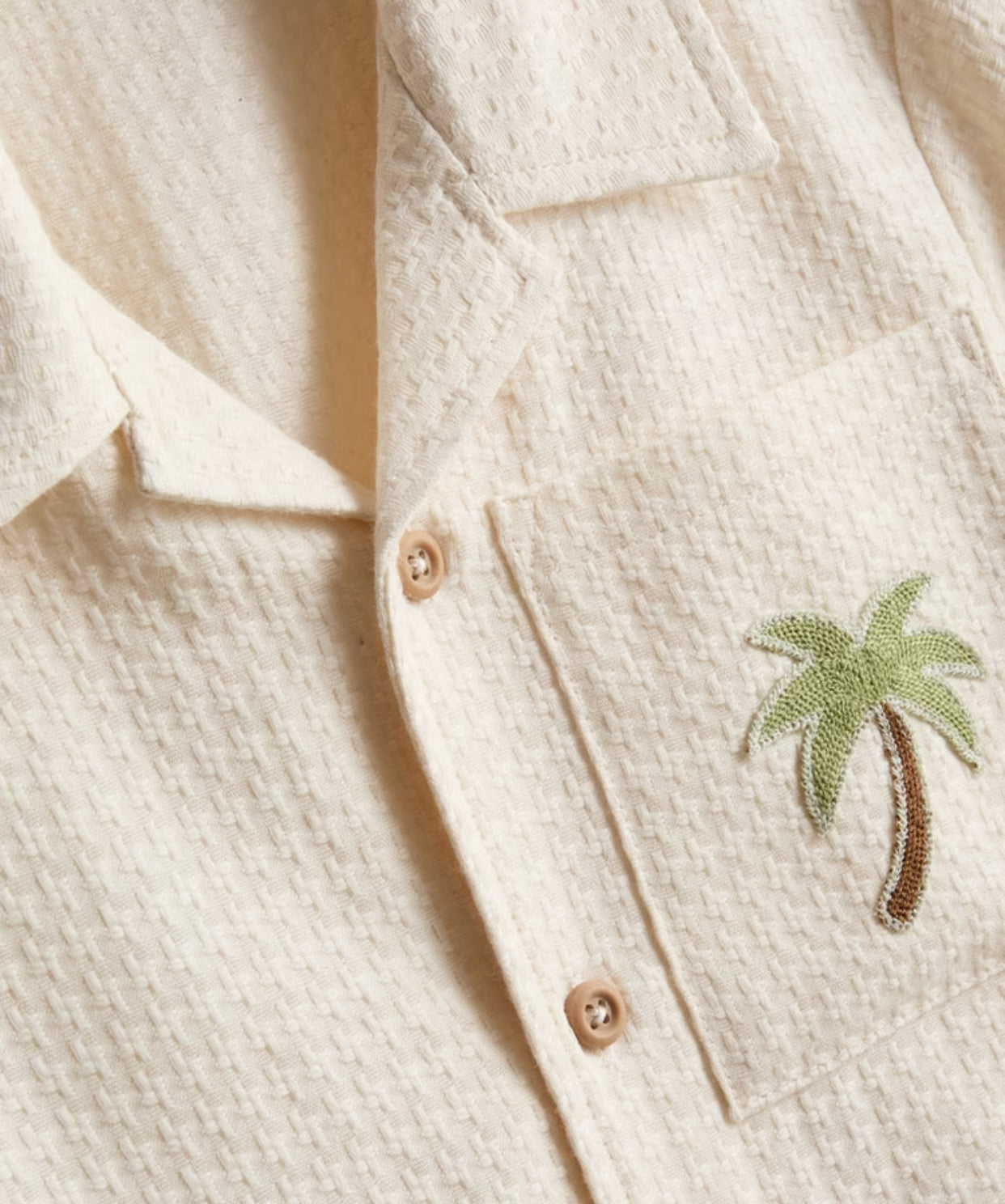 A shirt and shorts co-ord with embroidery detailing