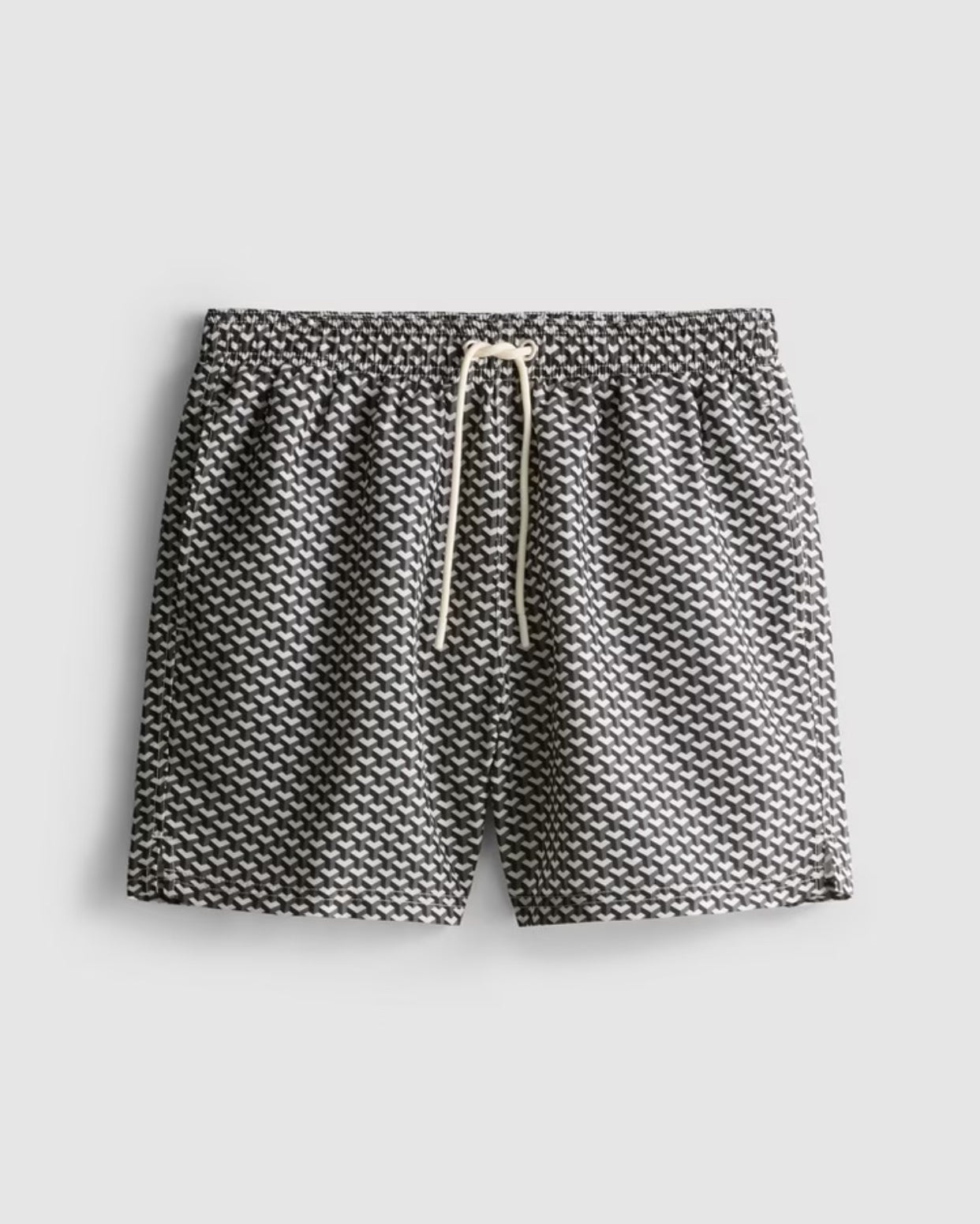 A pair of swimming shorts with a geometric design, mesh lining, and a drawstring waistline