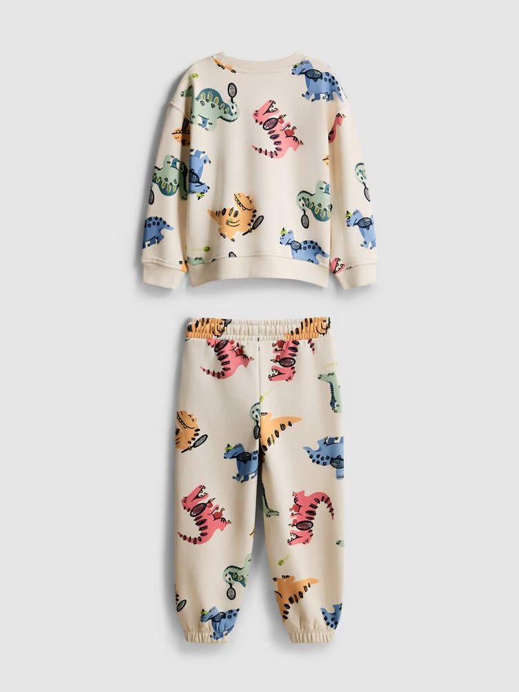 A sweatshirt and joggers clothing co-ord with an all-over dinosaur desian