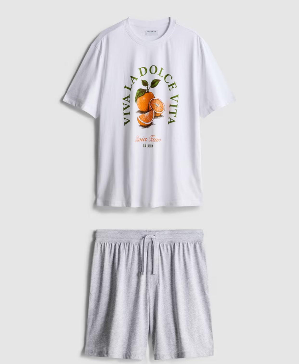 A pair of pyjamas with shorts, top, and graphic design