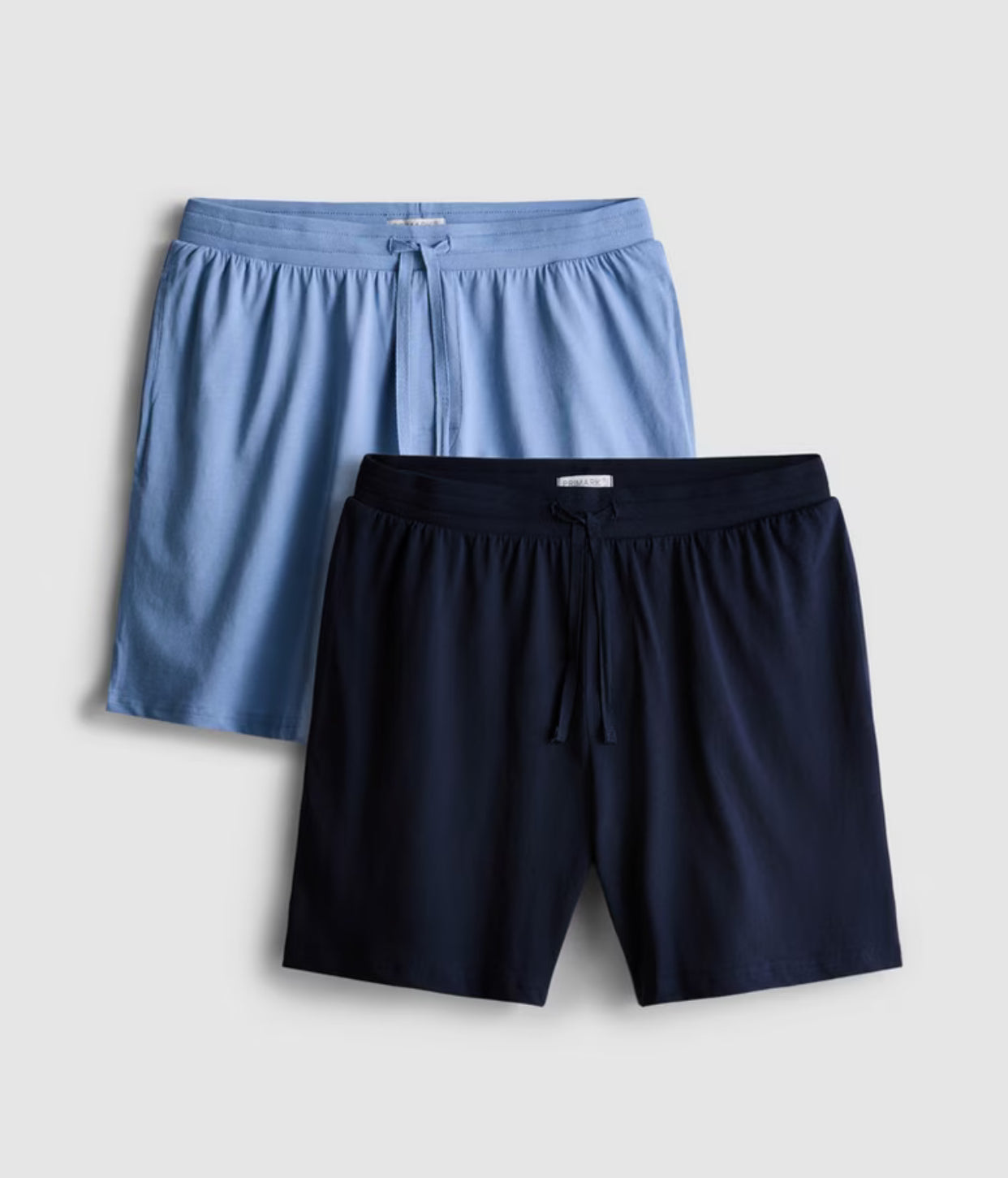 A set of two pyjama shorts with drawstring waistline, and pockets