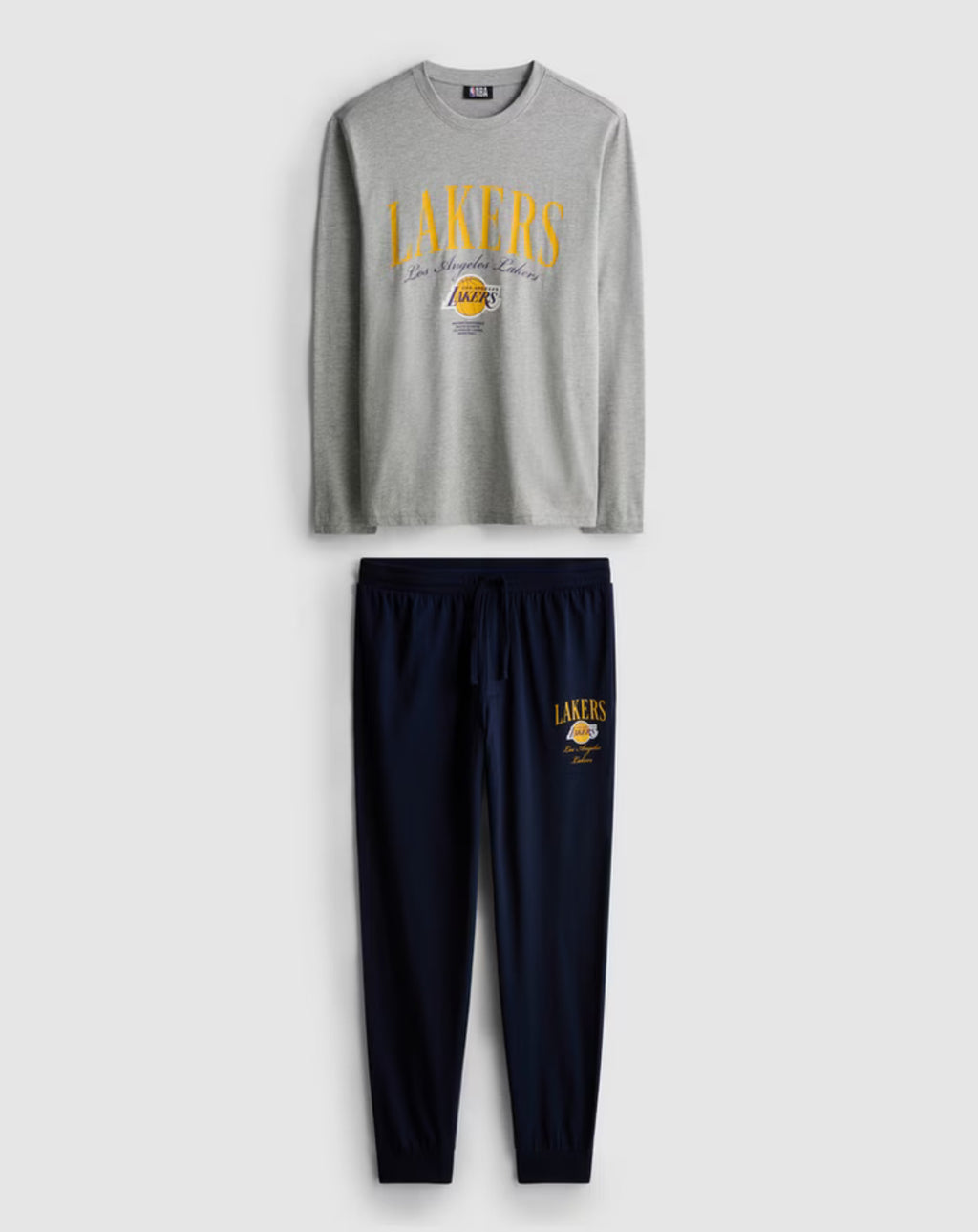 A pair of long pyjamas with tops and bottoms with Los Angeles Lakers design