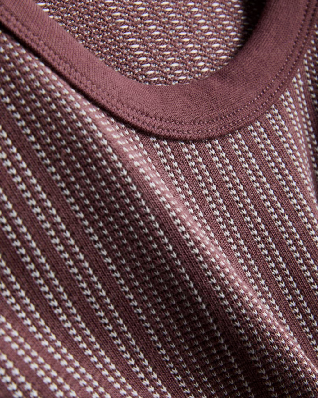 A pair of textured long pyjamas with a shortsleeved top and drawstring bottoms