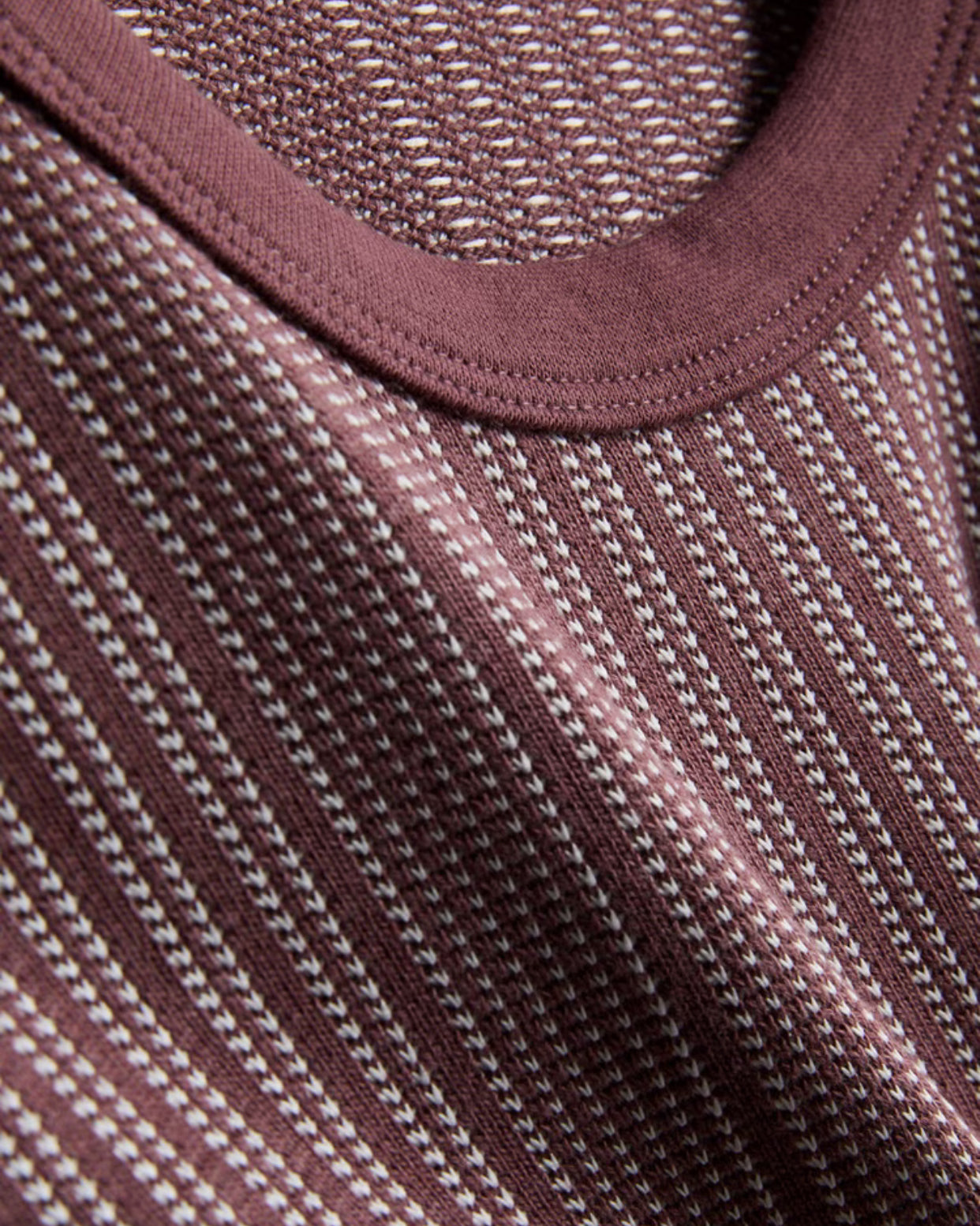 A pair of textured long pyjamas with a shortsleeved top and drawstring bottoms